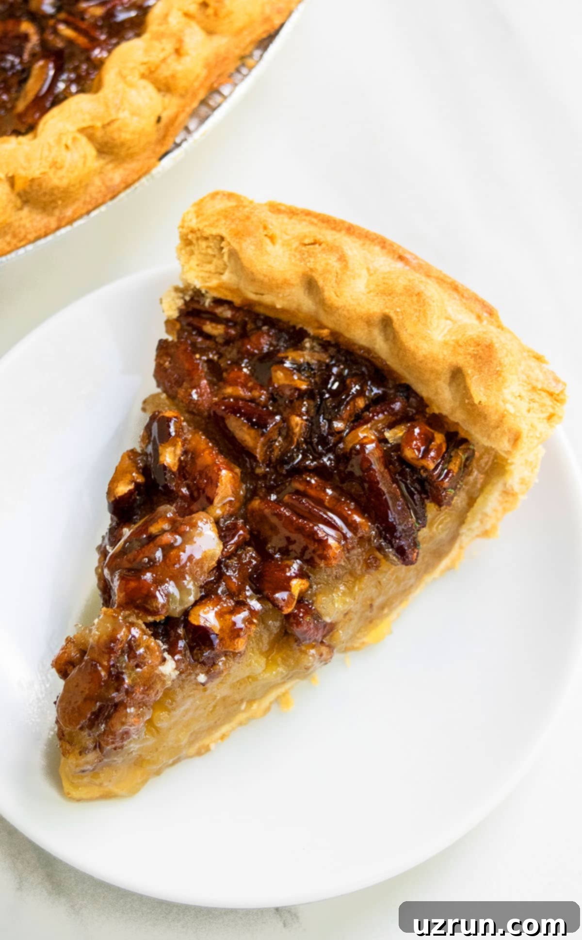 Perfectly Easy Pecan Pie 4 Slice of Pie on White Plate