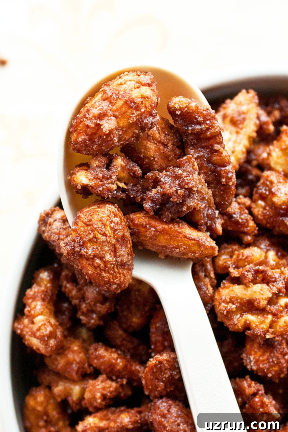 Homemade Candied Nuts 4 Spoonful of Glazed Nuts- Closeup Shot.