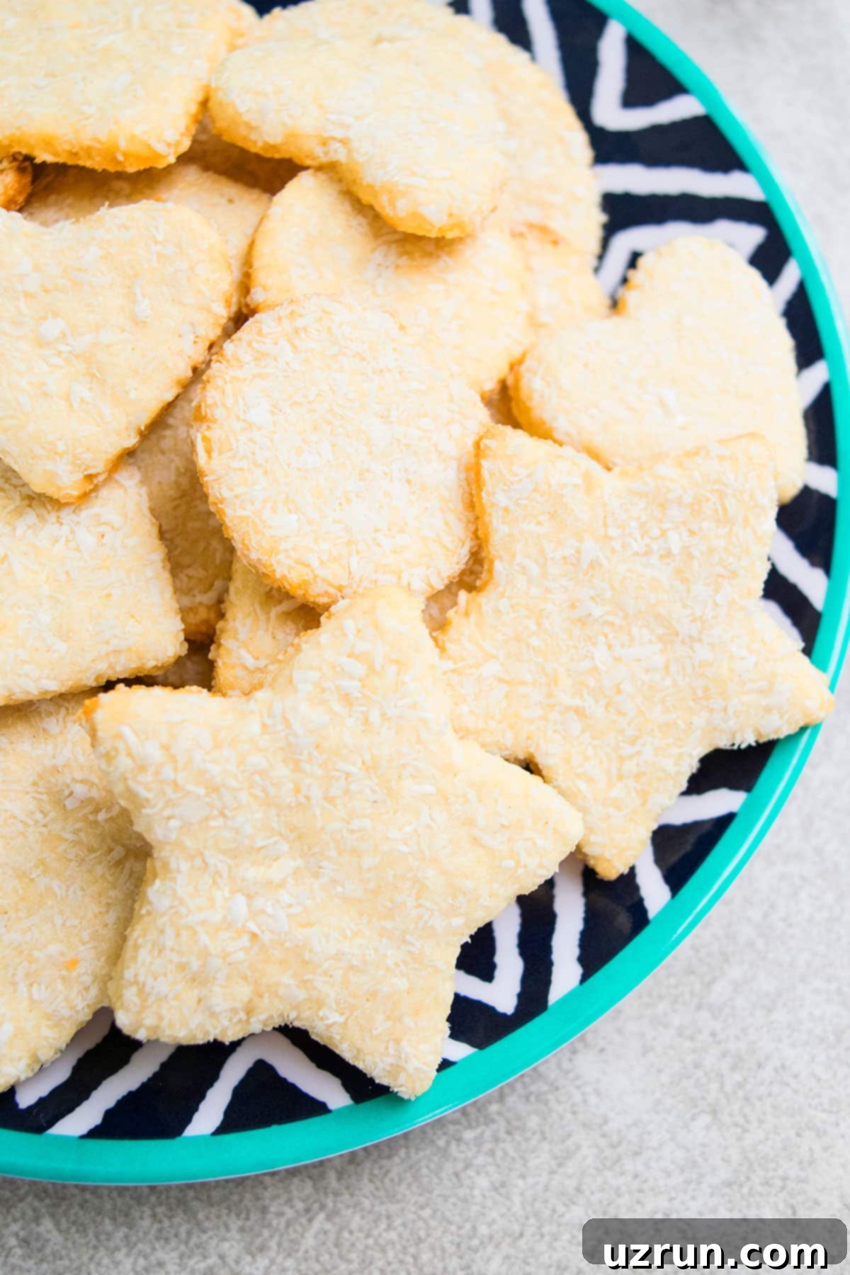 Easy Cut Out Coconut Sugar Cookies on Pattern Dish. 