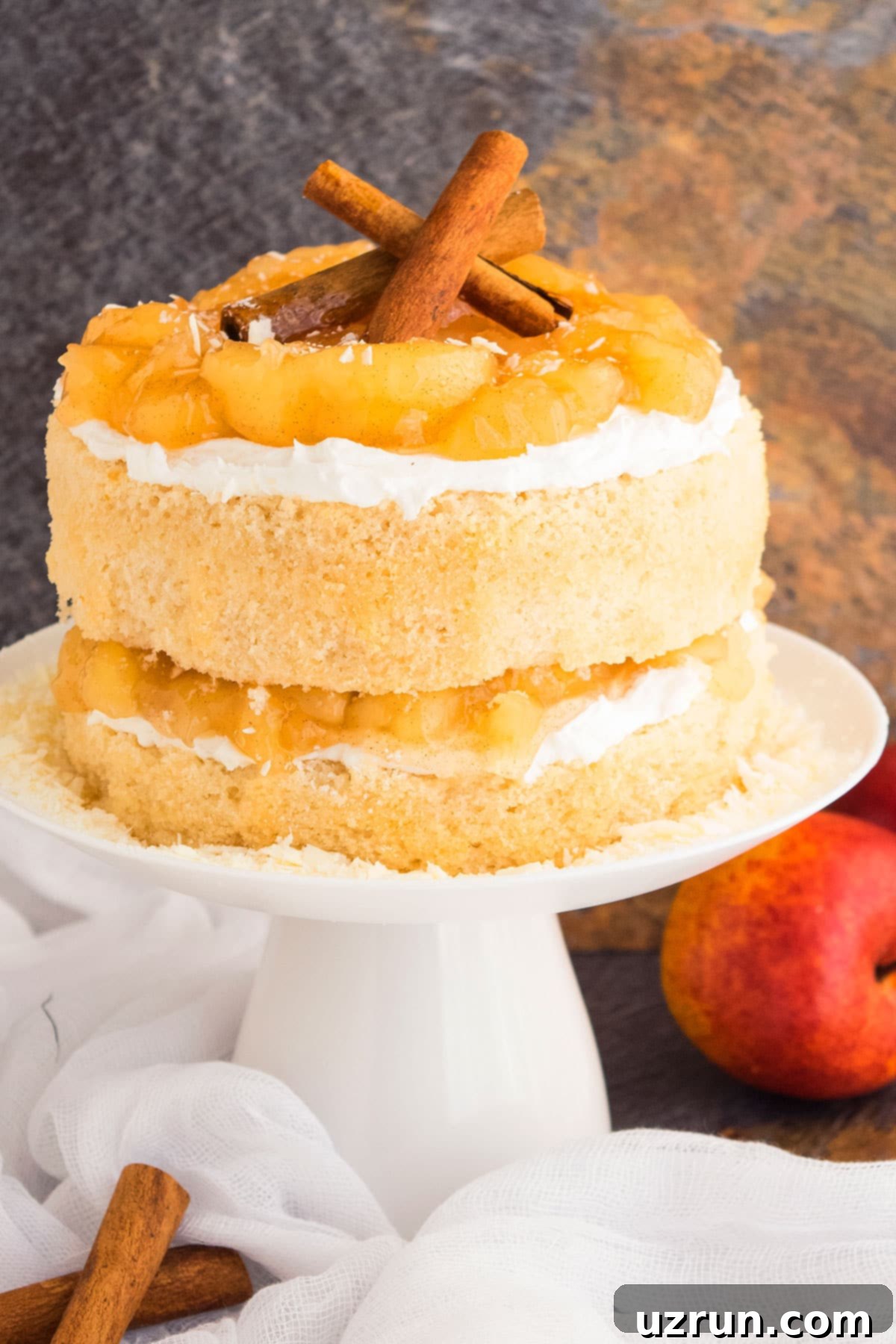 Easy Apple Pie Cake With Pie Filling and Buttercream Frosting on White Cake Stand