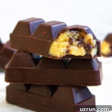 Eggless Chocolate Chip Cookie Dough Bars 7 Stack of Easy Homemade Eggless Chocolate Chip Cookie Dough Bars on White Marble Background.