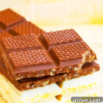 Peanut Butter Chocolate Crispy Bars 8 Stack of Easy Chocolate Crunch Bars on Sheet of Newspaper.