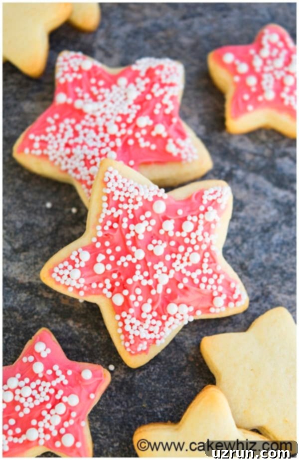 Champagne Frosted Cookies 3 Champagne Cut Out Cookies With Pink Champagne Frosting on Gray Background