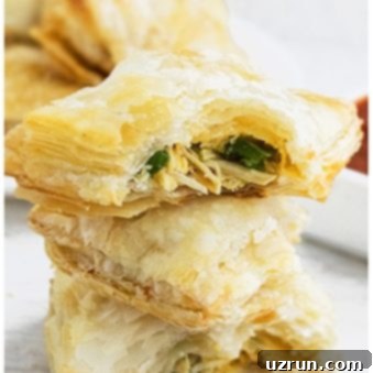 Cheesy Jalapeno Chicken Puffs 6 Stack of Easy Jalapeno Chicken Puff Pastry With One Partially Eaten.