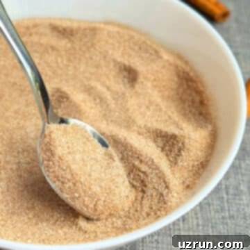 Effortless Homemade Cinnamon Sugar 7 Spoonful of combined ingredients in white bowl.