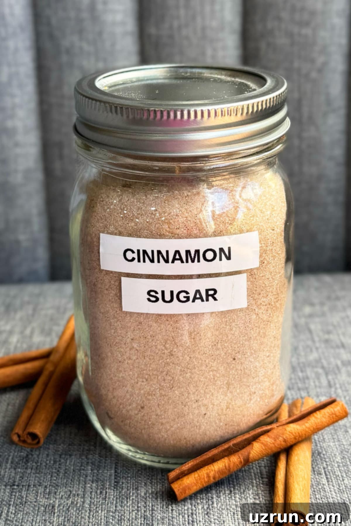 Effortless Homemade Cinnamon Sugar 8 Homemade spiced sugar mixture in glass mason jar.