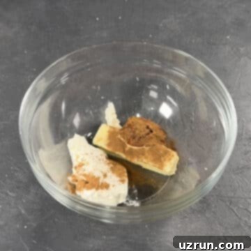 Easy Pumpkin Cream Cheese Frosting 5 Pumpkin puree, cream cheese, butter, pumpkin pie spice in glass bowl.