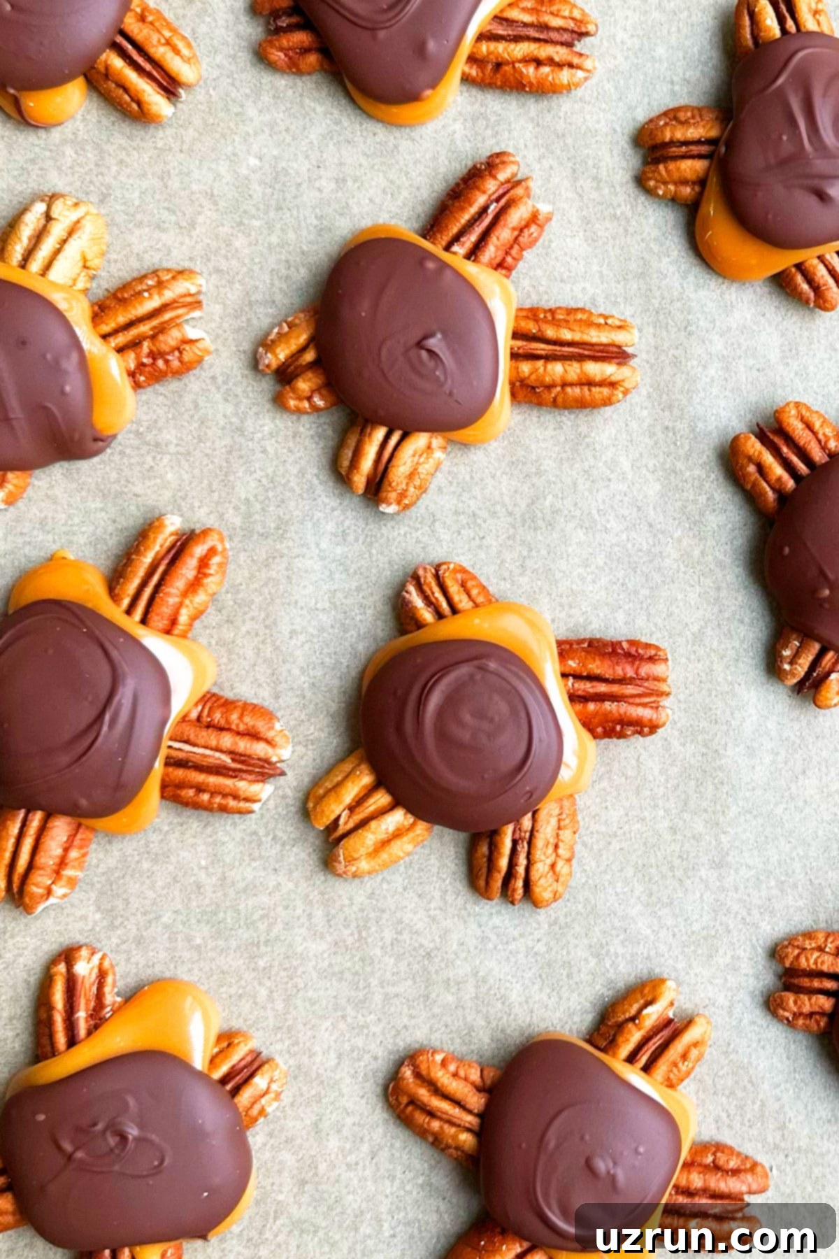 Decadent Homemade Chocolate Caramel Pecan Turtles 2 Easy Homemade Chocolate Turtles on Brown Wax Paper- Overhead Shot.