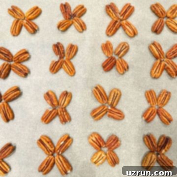 Decadent Homemade Chocolate Caramel Pecan Turtles 5 Pecan halves arranged in clusters of four on sheet of wax paper.