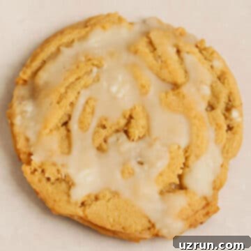 Easy Soft and Chewy Glazed Brown Sugar Maple Cookies on Beige Background- Closeup Shot.