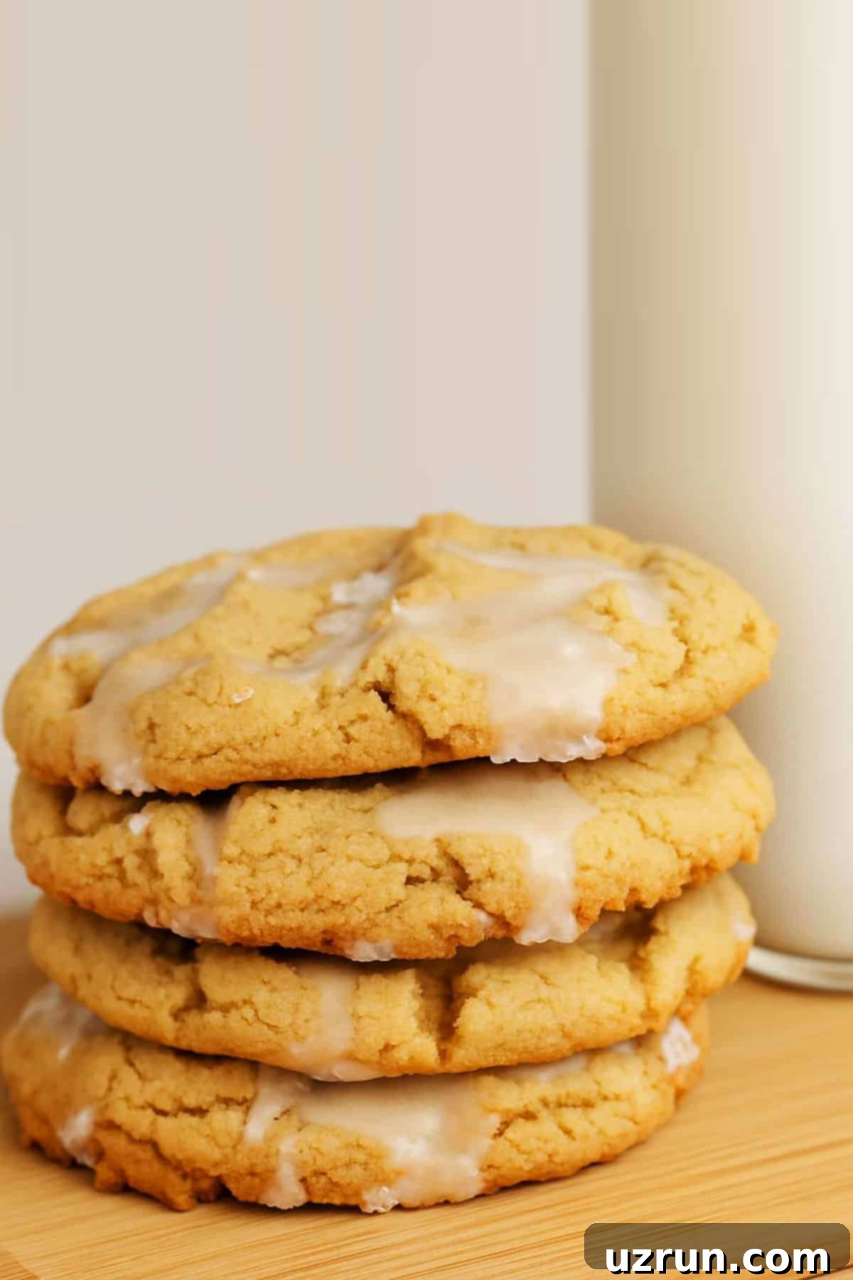 Effortless Soft Chewy Maple Cookies 10 Stack of Soft and Chewy Glazed Cookies With Brown Sugar on Wooden Tray.