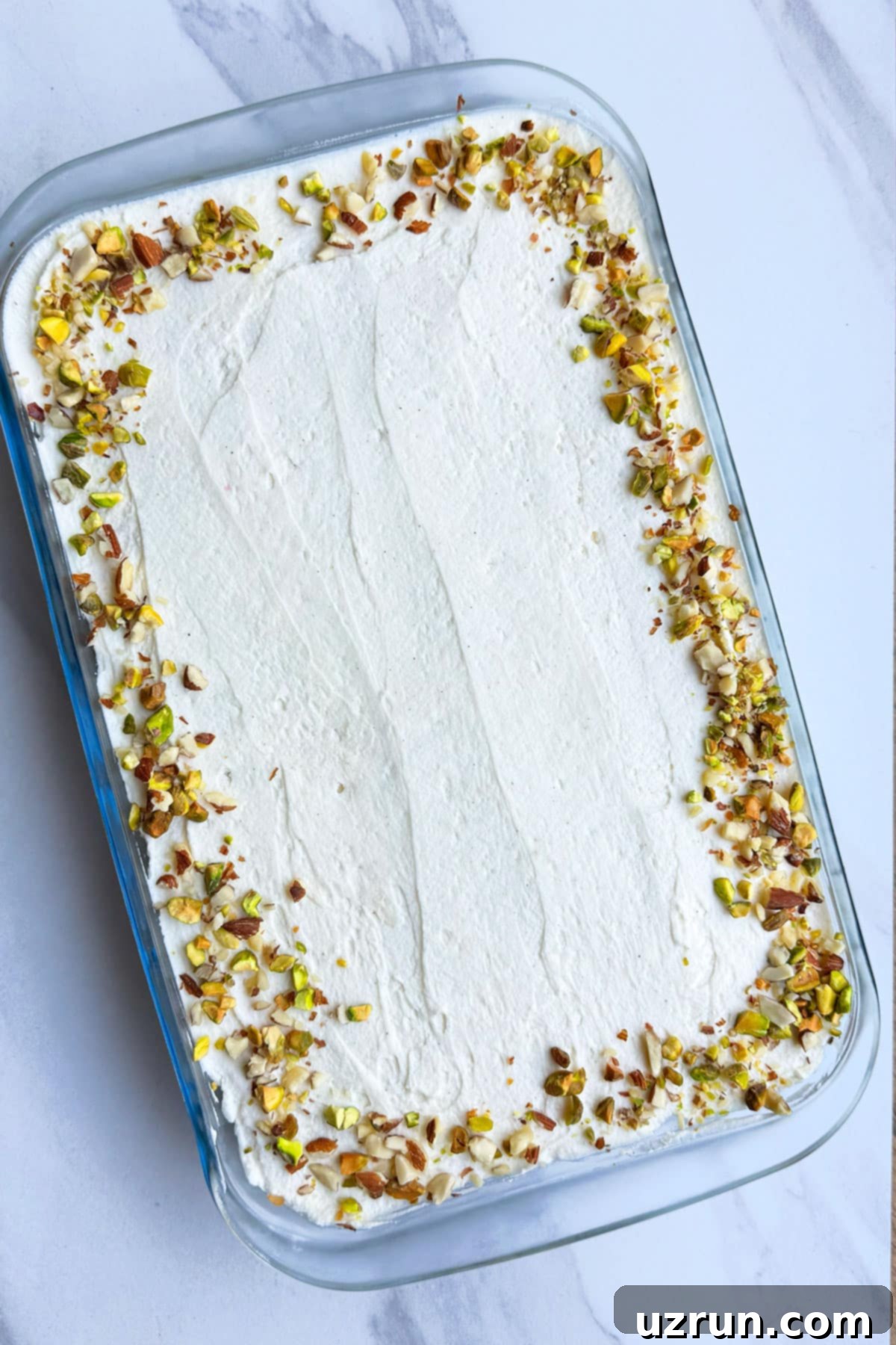 No-Bake Spiced Chai Tiramisu Cake 4 Indian No Bake Chai Cake on White Marble Background.